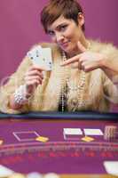 Woman in casino showing cards