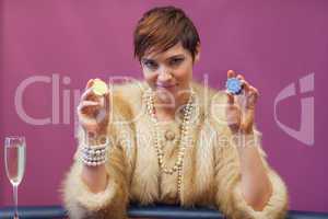 Woman in a casino holding chips