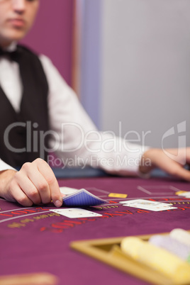 Dealer at table in a casino