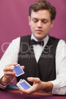 Dealer shuffling cards in a casino