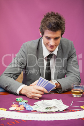 Man playing poker in a casino