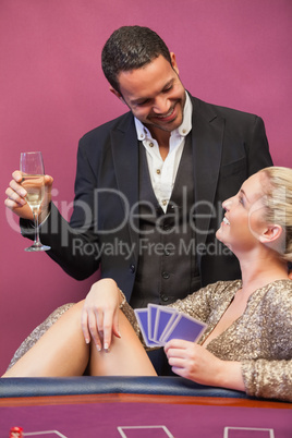 Two people flirting at poker table