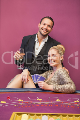 Happy couple at poker table