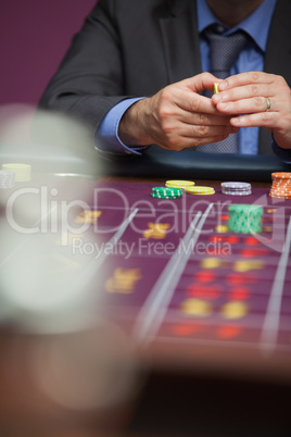 Man placing bet at roulette