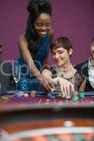 Two people playing roulette