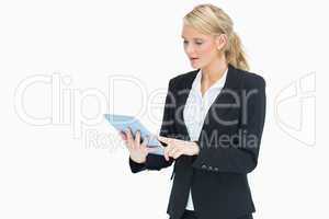 Blonde woman touching on her tablet