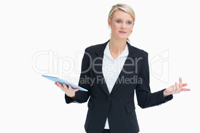 Woman wondering while holding tablet