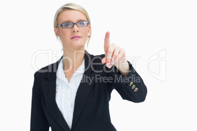 Blonde woman pointing in the air Blonde woman pointing in the air