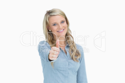 Woman giving thumbs up sign