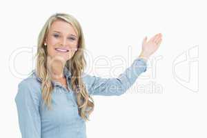 Happy woman presenting something