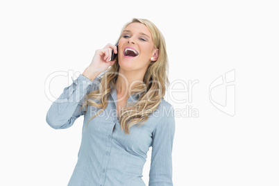 Woman laughing while calling