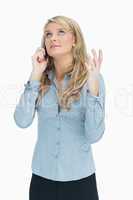 Woman explaining on the telephone