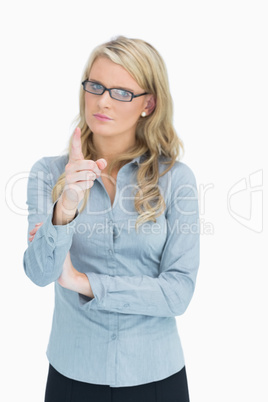 Blonde with glasses pointing