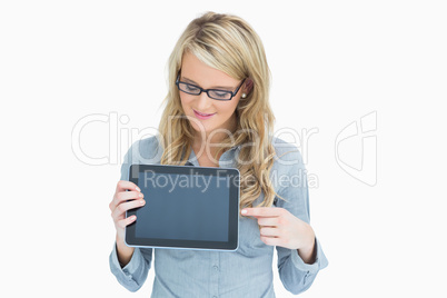 Woman showing tablet and pointing on it