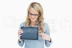 Woman showing tablet and pointing on it