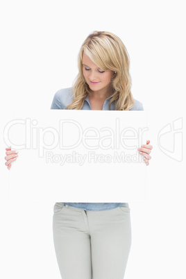 Woman holding a large piece of paper