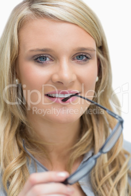 Woman holding glasses to her mouth