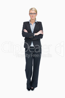 Standing businesswoman with folded arms