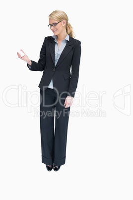 Businesswoman looking at her card Businesswoman looking at her card