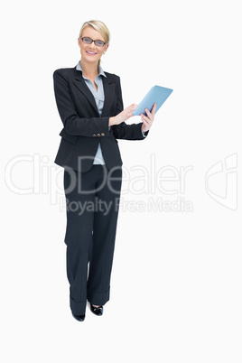 Smiling businesswoman using tablet pc