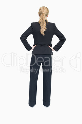 Businesswoman standing with back facing