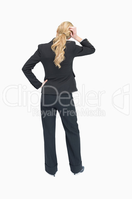 Thinking businesswoman backwards