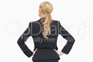 Businesswoman standing and thinking