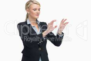 Standing businesswoman lifting hands