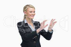 Smiling businesswoman air typing