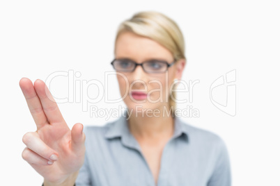 Businesswoman using two fingers to point