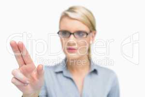 Businesswoman using two fingers to point