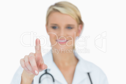 Smiling doctor pointing