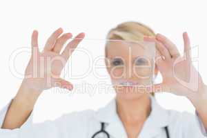 Doctor holding up clear pane