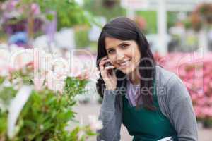 Smiling florist outside the garden centre
