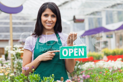 Woman pointing at the open sign