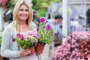 Customer holding flowers while smiling