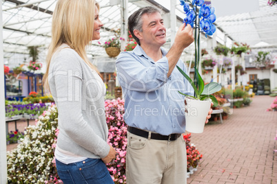 Happy couple looking at unusual plant