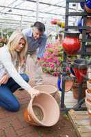 Couple looking at ceramic plant pot