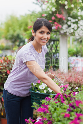 Smiling woman carrying basket