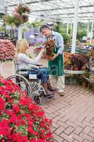 Woman in wheelchair buying a flower