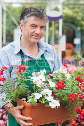 Employee holding large pot