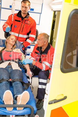 Paramedics help unconscious woman emergency aid