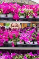 Woman looking through shelves in flowers store