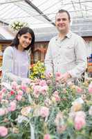 Smiling couple choosing flowers