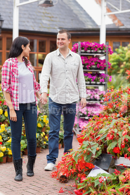 Couple walking in garden centre