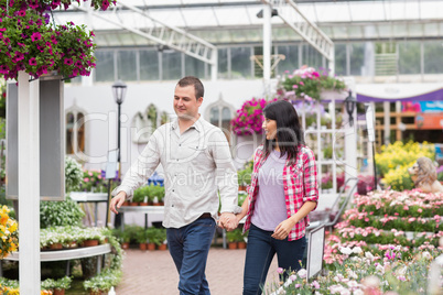 Couple walking through a garden center