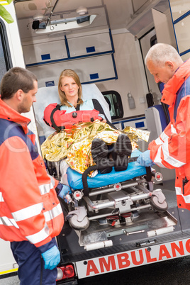 Patient secured in stretcher ambulance paramedics