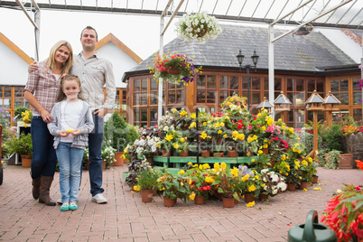 Family standing in the garden center