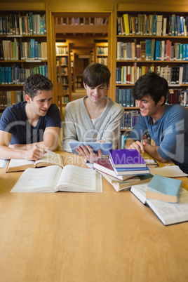 Men looking at tablet computer