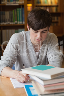 Man sitting at table writing